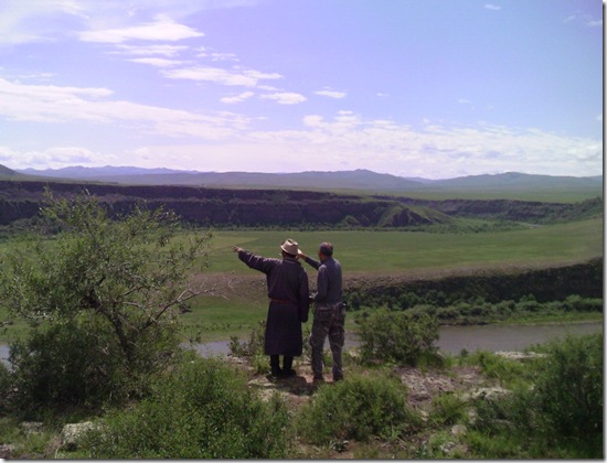 Herder shows where the dam is planned